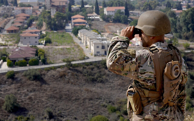 A Lebanese soldier looks through his binoculars into the Israeli border town of Metula, in the southern Lebanese village of Kafr Kila, October 8, 2023. (AP Photo/Hussein Malla, File) A Lebanese soldier looks through his binoculars into the Israeli border town of Metula, in the southern Lebanese village of Kafr Kila, October 8, 2023. (AP Photo/Hussein Malla, File)