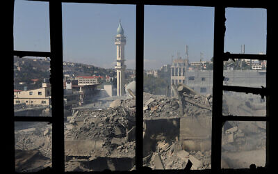 Illustrative: Destroyed buildings at a commercial street that was hit October 12, 2024, by Israeli airstrikes, are seen in Nabatiyeh town, south Lebanon, October 13, 2024. (AP Photo/Mohammed Zaatari)