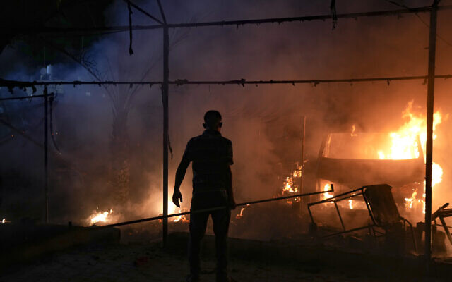 A Palestinian man reacts to a fire said to have been caused by an Israeli strike in the courtyard of Al Aqsa Martyrs hospital in Deir al-Balah, Gaza Strip, October 14, 2024. (AP Photo/Abdel Kareem Hana) A Palestinian man reacts to a fire said to have been caused by an Israeli strike in the courtyard of Al Aqsa Martyrs hospital in Deir al-Balah, Gaza Strip, October 14, 2024. (AP Photo/Abdel Kareem Hana)