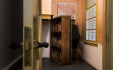 FILE - A woman enters the secret annex at the renovated Anne Frank House Museum in Amsterdam, Netherlands, November 21, 2018. (AP Photo/Peter Dejong, File)