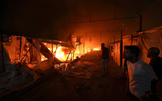 Palestinians react to a fire after an Israeli strike on Hamas targets at Al Aqsa Martyrs Hospital in Deir al-Balah, Gaza Strip, October 14, 2024. (AP Photo/Abdel Kareem Hana, File) Palestinians react to a fire after an Israeli strike on Hamas targets at Al Aqsa Martyrs Hospital in Deir al-Balah, Gaza Strip, October 14, 2024. (AP Photo/Abdel Kareem Hana, File)