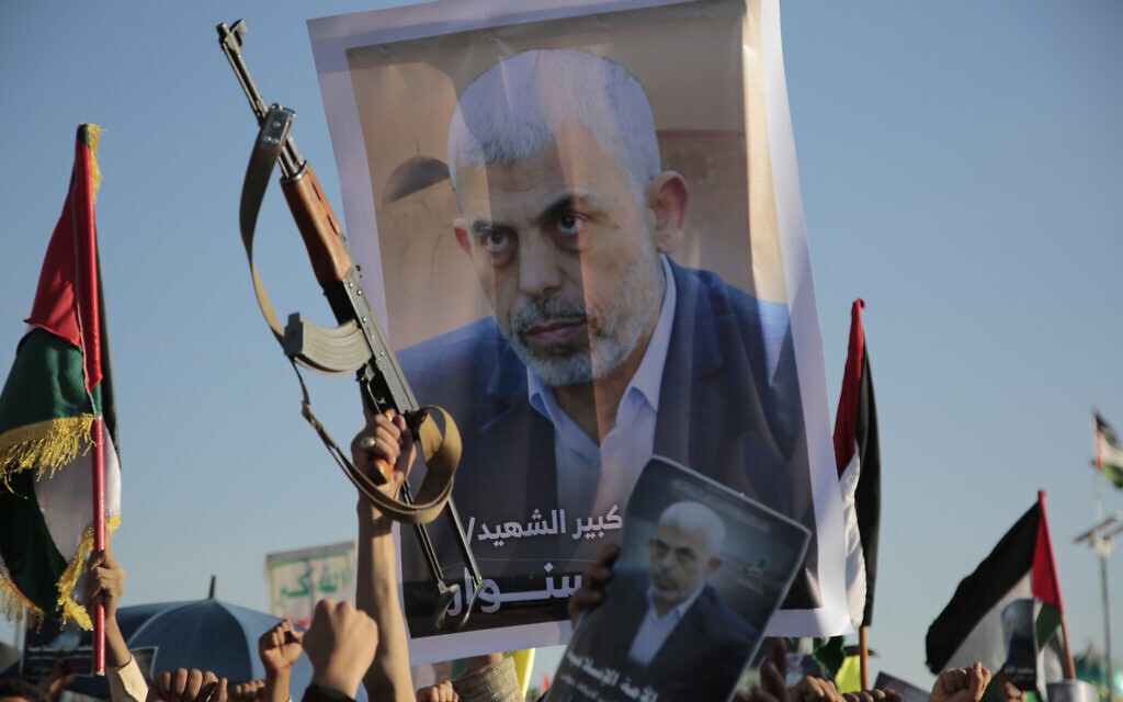 Houthi supporters raise a poster of Hamas leader Yahya Sinwar, who killed by Israeli troops in Gaza, during an anti-Israel rally in Sanaa, Yemen, October 18, 2024. (AP Photo/ Osamah Abdulrahman) Houthi supporters raise a poster of Hamas leader Yahya Sinwar, who killed by Israeli troops in Gaza, during an anti-Israel rally in Sanaa, Yemen, October 18, 2024. (AP Photo/ Osamah Abdulrahman)