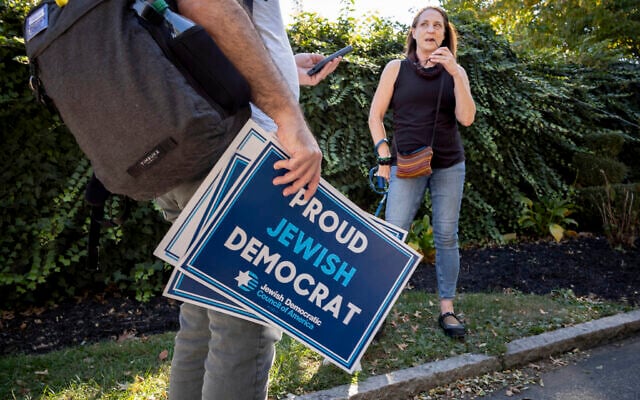 Dan Vogl, a US doctor from Bala Cynwyd, left, goes door to door to canvas Jewish voters during the Jewish holiday of Sukkot in Bala Cynwyd, Pennsylvania, October 20, 2024. (AP/Laurence Kesterson) Dan Vogl, a US doctor from Bala Cynwyd, left, goes door to door to canvas Jewish voters during the Jewish holiday of Sukkot in Bala Cynwyd, Pennsylvania, October 20, 2024. (AP/Laurence Kesterson)