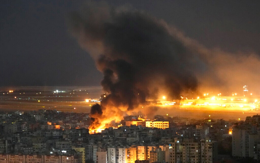 Flames and smoke are seen near Beirut's airport following an Israeli airstrike on the Dahiyeh suburb in Lebanon, October 20, 2024. (AP/Hussein Malla)