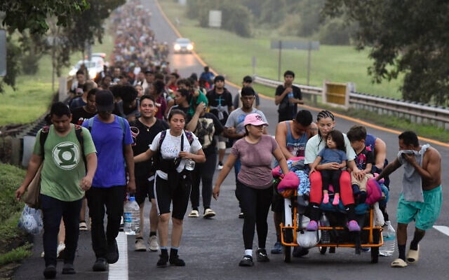Migrants walk along the Huixtla highway in the state of Chiapas, Mexico, October 22, 2024, hoping to reach the country's northern border and ultimately the United States. (AP Photo/Edgar H. Clemente) Migrants walk along the Huixtla highway in the state of Chiapas, Mexico, October 22, 2024, hoping to reach the country's northern border and ultimately the United States. (AP Photo/Edgar H. Clemente)