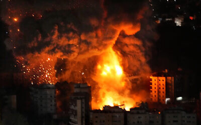 Flames and smoke rises from buildings hit by Israeli airstrikes on the southern suburb of Beirut, October 23, 2024. (AP Photo/Hussein Malla)