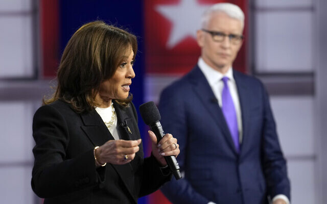 Democratic presidential nominee and US Vice President Kamala Harris speaks during a CNN town hall in Aston, Pennsylvania, October 23, 2024, as moderator Anderson Cooper listens. (AP Photo/Matt Rourke) Democratic presidential nominee and US Vice President Kamala Harris speaks during a CNN town hall in Aston, Pennsylvania, October 23, 2024, as moderator Anderson Cooper listens. (AP Photo/Matt Rourke)