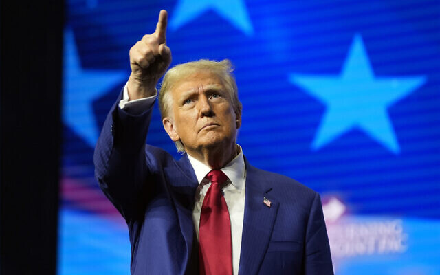 Republican presidential nominee former US president Donald Trump gestures at a campaign rally, October 23, 2024, in Duluth, Georgia. (AP Photo/Alex Brandon)