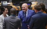 Karim Khan, center, prosecutor of International Criminal Court, greets members of delegations as he arrives for a Security Council meeting, July 13, 2023, at United Nations headquarters. (AP/Mary Altaffer, File)
