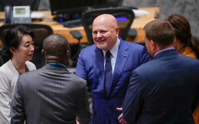 Karim Khan, center, prosecutor of International Criminal Court, greets members of delegations as he arrives for a Security Council meeting, July 13, 2023, at United Nations headquarters. (AP Photo/Mary Altaffer, File)