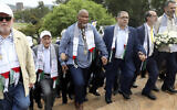 Nelson Mandela's grandson Mandla Mandela, center, with Hamas official Basem Naim, center right, during a march to commemorate the 10th anniversary of the death of former South African president Nelson Mandela in Pretoria, South Africa, December 5, 2023. (AP Photo, File)