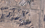 This satellite photo from Planet Labs PBC shows damaged buildings at Iran's Parchin military base outside of Tehran, Iran, October 27, 2024. The damaged structures are in the bottom right corner and bottom center of the image. (Planet Labs PBC via AP)
