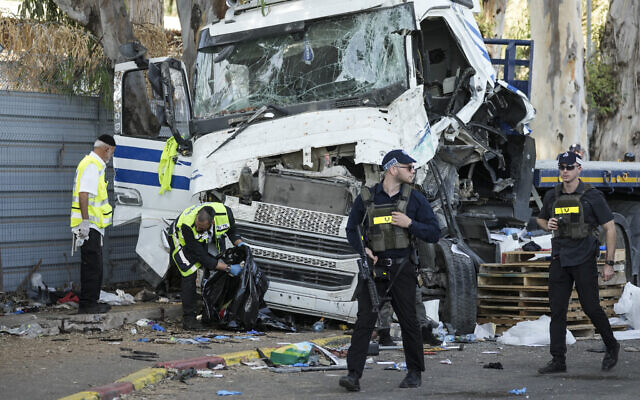 Emergency services at the scene of a suspected truck ramming attack in Glilot, north of Tel Aviv on October 27, 2024 (AP Photo/Oded Balilty) Emergency services at the scene of a suspected truck ramming attack in Glilot, north of Tel Aviv on October 27, 2024 (AP Photo/Oded Balilty)