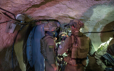 Soldiers are seen in a Hezbollah tunnel in southern Lebanon, late on October 21, 2024. (Emanuel Fabian/Times of Israel)