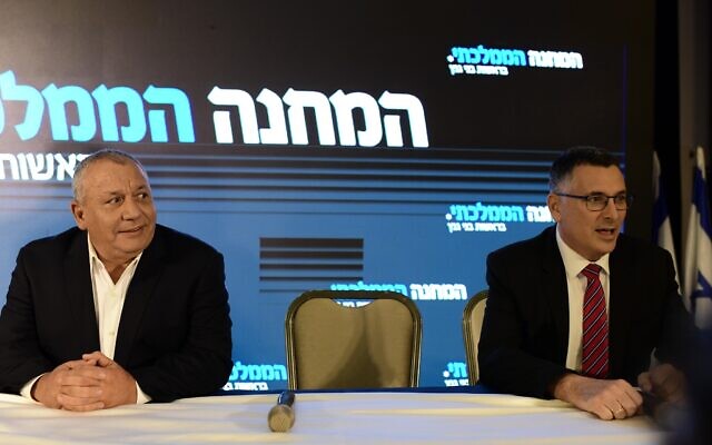 Then-justice minister and head of the New Hope party Gideon Sa'ar, right, and Blue and White MK Gadi Eisenkot hold a press conference announcing the merger of their parties into the National Unity alliance, in Ramat Gan, August 14, 2022. (Tomer Neuberg/Flash90) Then-justice minister and head of the New Hope party Gideon Sa'ar, right, and Blue and White MK Gadi Eisenkot hold a press conference announcing the merger of their parties into the National Unity alliance, in Ramat Gan, August 14, 2022. (Tomer Neuberg/Flash90)