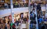 Illustrative: People shopping at the Azrieli mall in Tel Aviv, during the Municipal Elections, February 27, 2024. (Flash90)