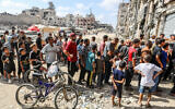 Palestinians line up to buy bread at a bakery run by the UN World Food Programme and UNRWA in in Khan Younis, in the southern Gaza Strip, on September 8, 2024. (Abed Rahim Khatib/Flash90)