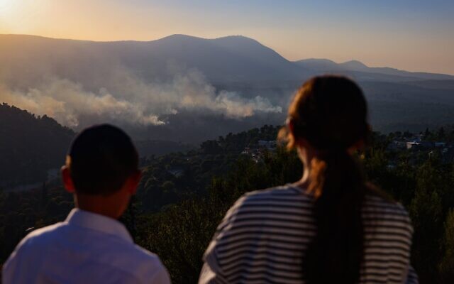 Smoke rises from a fire which broke out from missiles fired from Lebanon at a forest outside the northern Israeli city of Tzfat, September 24, 2024. (David Cohen/ Flash90)