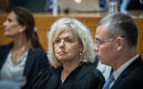 Attorney General Gali Baharav-Miara (center) and Justice Minister Yariv Levin (right) at a farewell ceremony for retiring acting Supreme Court president Uzi Vogelman, at the Supreme Court in Jerusalem, October 1, 2024. (Oren Ben Hakoon/POOL)