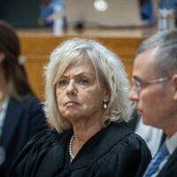 Attorney General Gali Baharav-Miara and Justice Minister Yariv Levin at a farewell ceremony for retiring acting Supreme Court president Uzi Vogelman, at the Supreme Court in Jerusalem, October 1, 2024. (Oren Ben Hakoon/POOL)