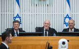 Outgoing Acting Supreme Court President Uzi Vogelman with incoming Acting Supreme Court President Isaac Amit (L) and Justice Noam Sohlberg (R) at a farewell ceremony for Vogelman at the Supreme Court in Jerusalem, October 1, 2024. (Oren Ben Hakoon/Pool)