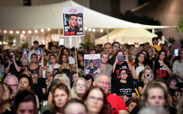 Israelis attend an event calling for the release of hostages still held captive by Hamas terrorists in Gaza, and in memory of those killed in the group's attack last October 7, on the eve of the first anniversary of the attack, at "Hostage Square" in Tel Aviv, October 6, 2024. (Avshalom Sassoni/Flash90) Israelis attend an event calling for the release of hostages still held captive by Hamas terrorists in Gaza, and in memory of those killed in the group's attack last October 7, on the eve of the first anniversary of the attack, at "Hostage Square" in Tel Aviv, October 6, 2024. (Avshalom Sassoni/Flash90)