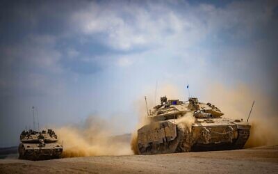 Israeli military vehicles and tanks near the Gaza border, as they prepare to enter the Strip for a military operation, October 6, 2024 (Yonatan Sindel/ Flash90)