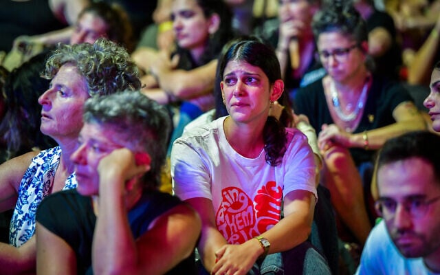 Israelis in Hostages Square in Tel Aviv watch a screening of the National Memorial Ceremony for Bereaved Families in nearby Yarkon Park on October 7, 2024. (Avshalom Sassoni/Flash90) Israelis in Hostages Square in Tel Aviv watch a screening of the National Memorial Ceremony for Bereaved Families in nearby Yarkon Park on October 7, 2024. (Avshalom Sassoni/Flash90)