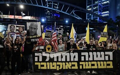 Families of Israelis held kidnapped by Hamas terrorists in Gaza and activists protest for their release outside the Defense Ministry headquarters in Tel Aviv, October 7, 2024. (Tomer Neuberg/Flash90)