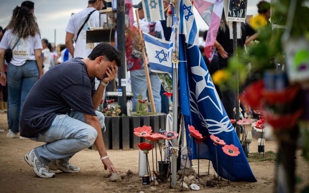 Friends and family of the victims of the Nova music festival massacre gather at the site of the massacre in southern Israel one year after the attack, October 7, 2024. (Yonatan Sindel/Flash90) Friends and family of the victims of the Nova music festival massacre gather at the site of the massacre in southern Israel one year after the attack, October 7, 2024. (Yonatan Sindel/Flash90)