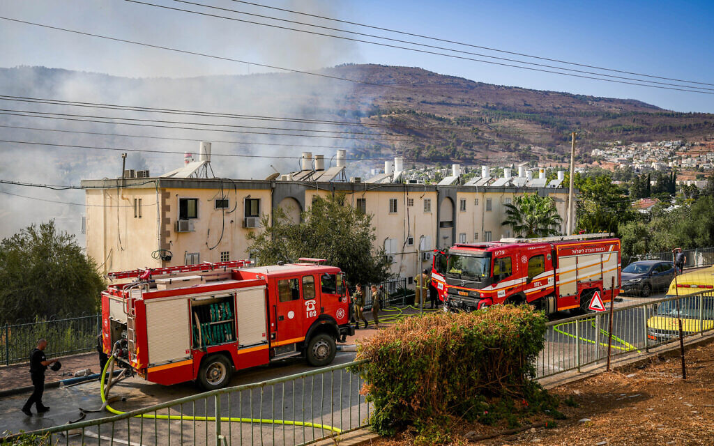 Israeli security and rescue forces at the site where a missile fired from Lebanon hit in the northern town of Kiryat Shmona, October 9, 2024. (Ayal Margolin/Flash90)