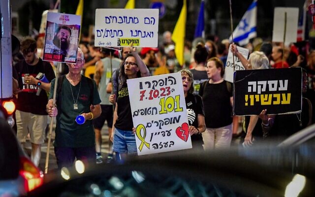 Israelis protest, calling for a deal to secure the release of those held hostage by Hamas in Gaza, near the Defense Ministry Headquarters in Tel Aviv, October 14, 2024. Some of the signs read "Deal now!" and note that 101 hostages, living and dead, remain in the terror group's hands. (Avshalom Sassoni/Flash90) Israelis protest, calling for a deal to secure the release of those held hostage by Hamas in Gaza, near the Defense Ministry Headquarters in Tel Aviv, October 14, 2024. Some of the signs read "Deal now!" and note that 101 hostages, living and dead, remain in the terror group's hands. (Avshalom Sassoni/Flash90)