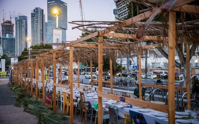 A sukkah with seats for Israelis held hostage by Hamas in the Gaza Strip, at Hostages Square in Tel Aviv. October 14, 2024. (Chaim Goldberg/Flash90) A sukkah with seats for Israelis held hostage by Hamas in the Gaza Strip, at Hostages Square in Tel Aviv. October 14, 2024. (Chaim Goldberg/Flash90)