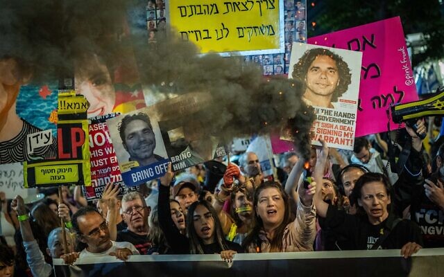 Protesters call for a hostage deal to secure the release of captives held in Gaza by the Hamas terror group, outside the Defense Ministry headquarters in Tel Aviv, October 26, 2024. (Erik Marmor/Flash90) Protesters call for a hostage deal to secure the release of captives held in Gaza by the Hamas terror group, outside the Defense Ministry headquarters in Tel Aviv, October 26, 2024. (Erik Marmor/Flash90)