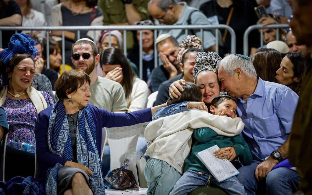 Family and friends of Master Sgt. (res.) Gilad Elmaliach, 30, killed in Lebaon, attend his funeral at Mount Herzl Military Cemetery in Jerusalem on October 27, 2024 (Chaim Goldberg/Flash90)