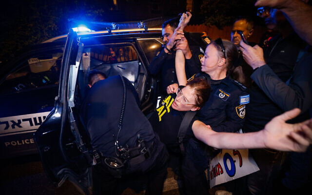 Police clash with demonstrators during a protest outside the Prime Minister's Residence in Jerusalem, October 28, 2024. (Chaim Goldberg/Flash90) Police clash with demonstrators during a protest outside the Prime Minister's Residence in Jerusalem, October 28, 2024. (Chaim Goldberg/Flash90)