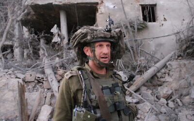 The commander of the Etzioni Brigade's 8103rd Battalion, Lt. Col. Elishama Jacobs, stands in a ruined village in southern Lebanon on October 21, following a sweep by members of the Etzioni brigade. (Sam Sokol/Times of Israel)
