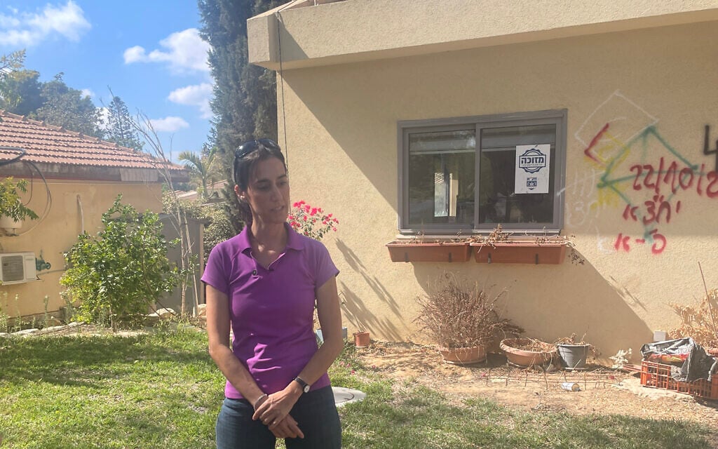 Batsheva Yahalomi in front of her Kibbutz Nir Oz home on September 30, 2024, where she, her husband and three children were grabbed by terrorists on October 7, 2023. (Jessica Steinberg/Times of Israel) Batsheva Yahalomi in front of her Kibbutz Nir Oz home on September 30, 2024, where she, her husband and three children were grabbed by terrorists on October 7, 2023. (Jessica Steinberg/Times of Israel)
