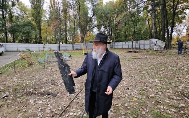 Rabbi Jonathan Markovitch holds a fragment of a Russian drone that damaged the Chabad-run Perlina school in Kyiv, Ukraine, October 30, 2024. (Courtesy Kyiv Jewish Community via JTA) Rabbi Jonathan Markovitch holds a fragment of a Russian drone that damaged the Chabad-run Perlina school in Kyiv, Ukraine, October 30, 2024. (Courtesy Kyiv Jewish Community via JTA)