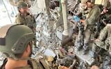 IDF troops stand over the body of Hamas leader Yahya Sinwar in Gaza on October 17, 2024. (Courtesy)