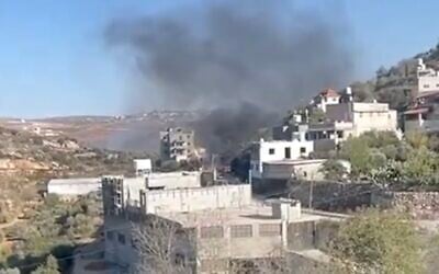 Smoke rises over the Palestinian village of Jalud in the northern West Bank after settlers allegedly torched homes, land and a poultry farm on October 19, 2024. (Video screenshot, X; used in accordance with Clause 27a of the Copyright Law)