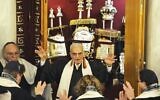 Rabbi Walter Jacob, center, ordains three rabbis during a ceremony at the Pestalozzi strasse Synagogue in Berlin, Novemer 4, 2010. (Odd Andersen/AFP via Getty Images/via JTA)