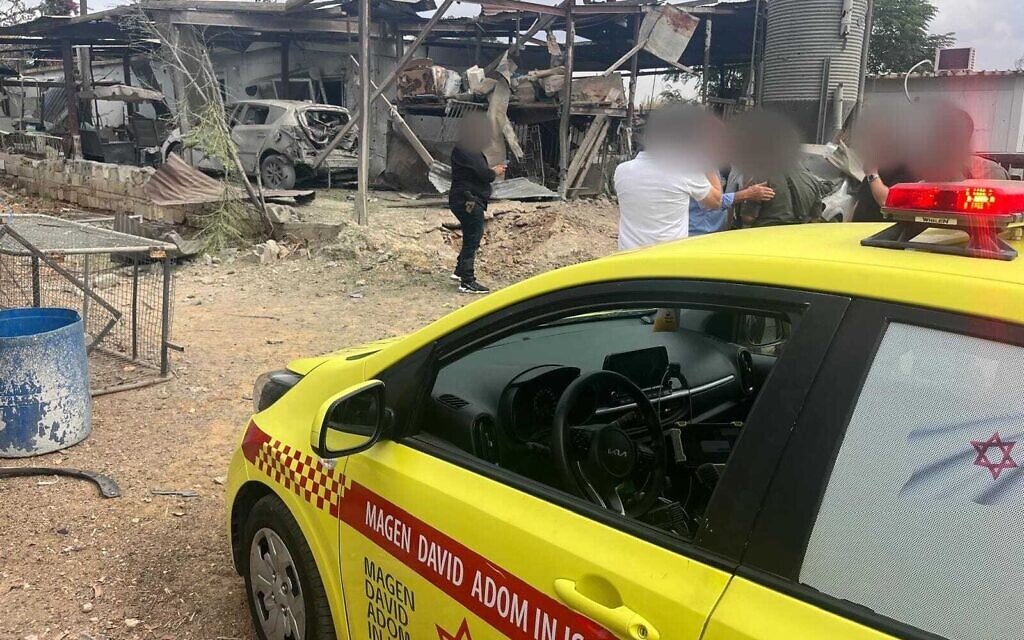 Medics at the scene of a rocket impact that lightly wounded two people in central Israel on October 7, 2024. Hamas says it targeted Tel Aviv on anniversary of massacre. (Magen David Adom)