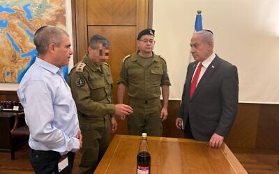 Prime Minister Benjamin Netanyahu (right) and his hostages pointman Gal Hirsch, pictured at the start of the Sukkot holiday, October 16, 2024. (Courtesy)