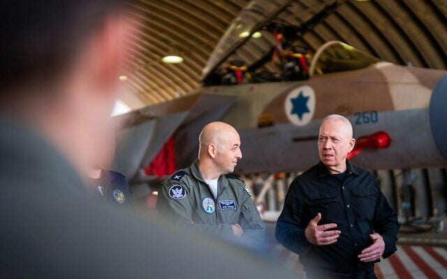 Defense Minister Yoav Gallant (right) speaks to Israeli Air Force pilots and crews at the Hatzerim Airbase, October 23, 2024. (Ariel Hermoni/Defense Ministry) Defense Minister Yoav Gallant (right) speaks to Israeli Air Force pilots and crews at the Hatzerim Airbase, October 23, 2024. (Ariel Hermoni/Defense Ministry)