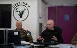 Defense Minister Yoav Gallant (right) meets with Maj. Gen. Ori Gordin (left) at the Northern Command HQ in Safed, October 29, 2024. (Ariel Hermoni/Defense Ministry)