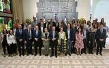 President Isaac Herzog (center) and his wife Michal (to his left) pose at the President's Residence in Jerusalem with members of the Israeli delegation to the upcoming United Nations COP29 climate conference in Baku, Ajerbaijan, October 29, 2024. (Mayan Toaf / GPO)
