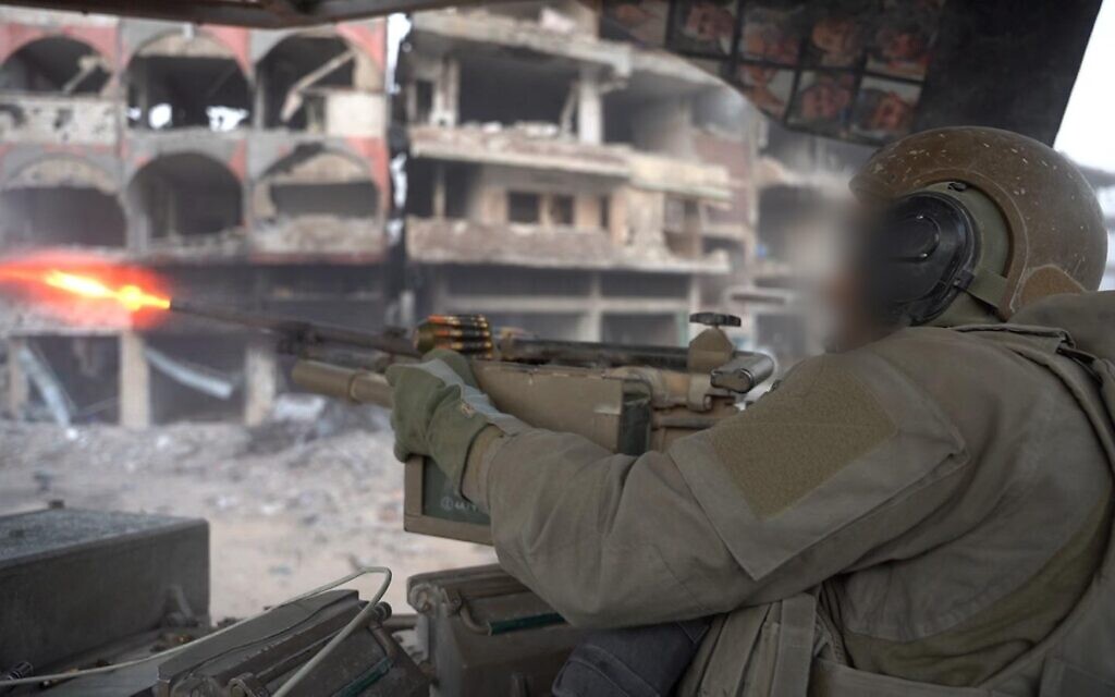 An IDF soldier fires a shot in the Gaza Strip in a handout image published on October 30, 2024. (Israel Defense Forces)