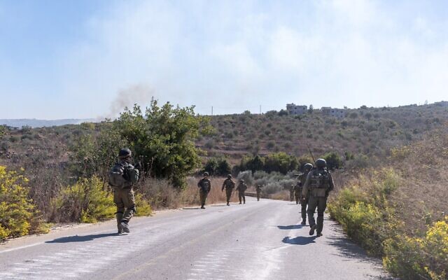 Reservists of the Carmeli Brigade are seen during operations in southern Lebanon, in a handout photo published on October 29, 2024. (Israel Defense Forces)