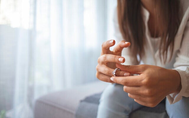 Illustrative: A Woman removes her wedding ring. (Dragana991/iStock)